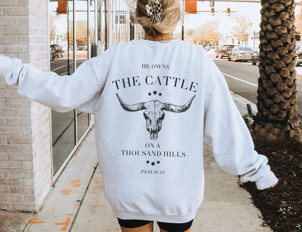 He owns the cattle crewneck